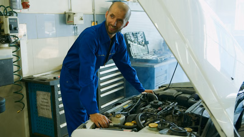 APPLIANCE MATTERS LTD technician inspecting a refrigerator
